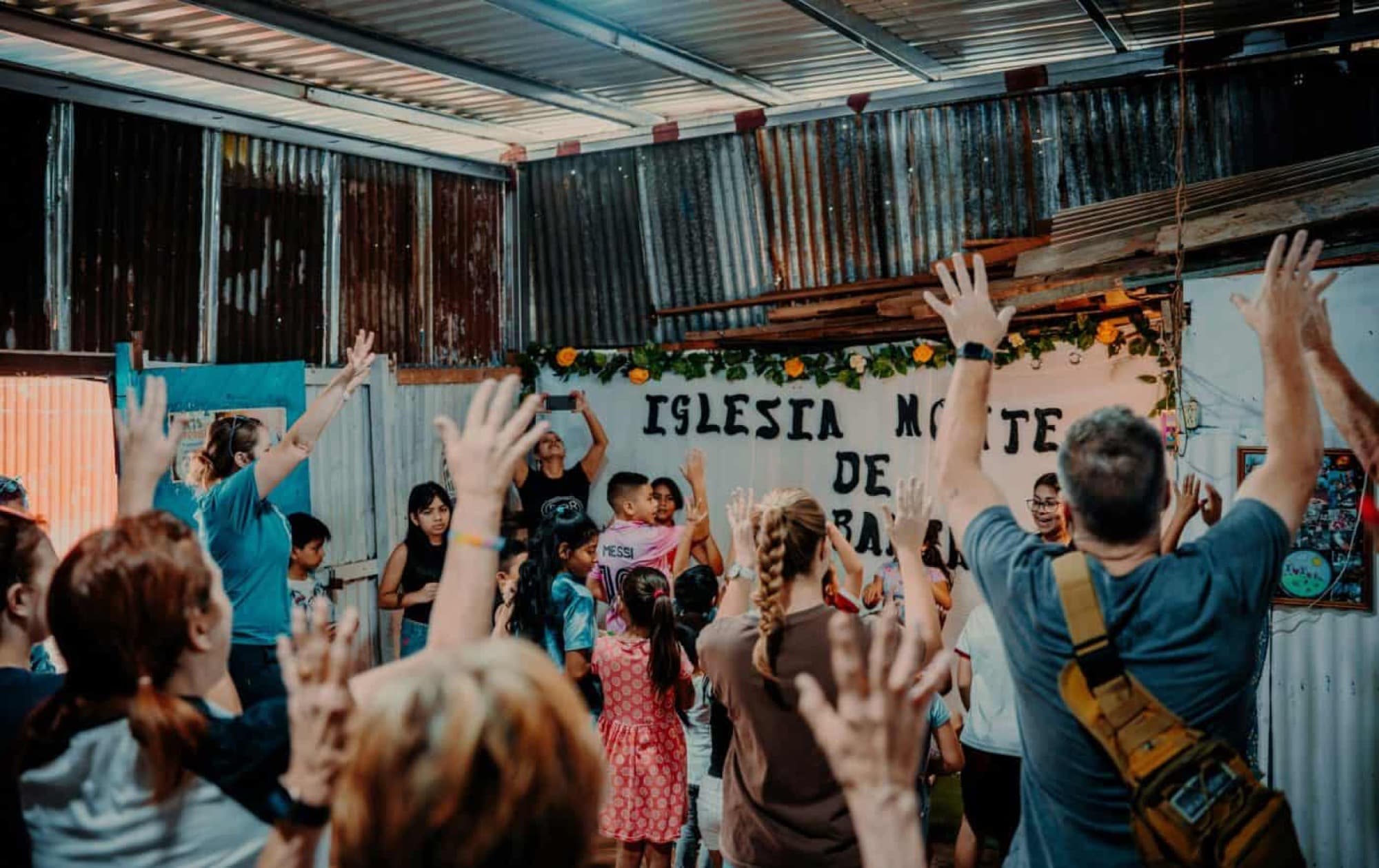 Mission team worshiping with a church in Peru
