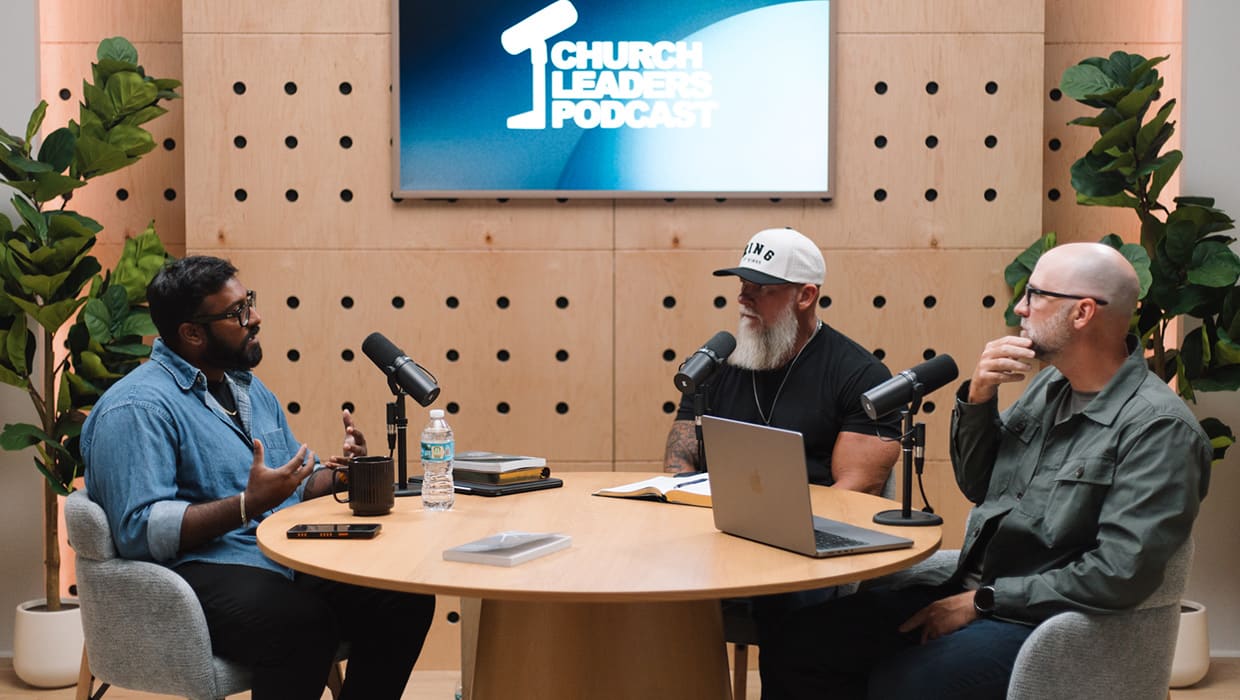 Three hosts recording an episode in the Eleven22 podcast studio