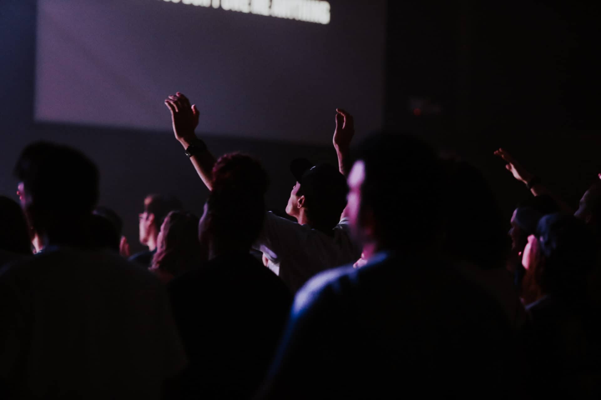Young adults worshipping at an 1825 gathering